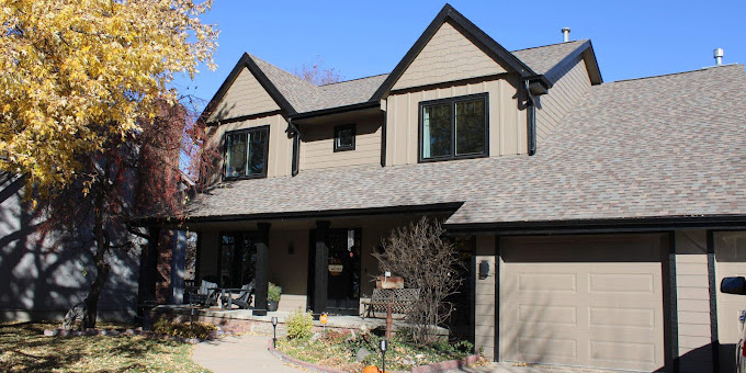 beige siding matching roofing shingles